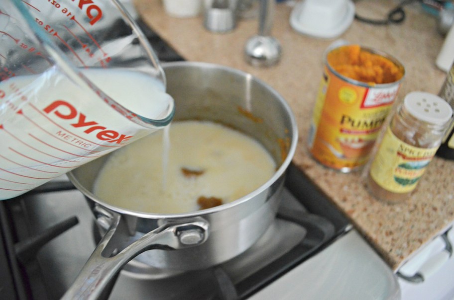 pouring milk into pumpkin puree