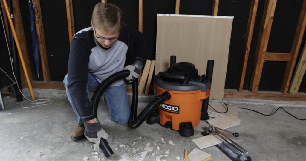 man using ridgid wetdry vac