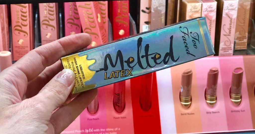 hand holding Too Faced Melted Latex