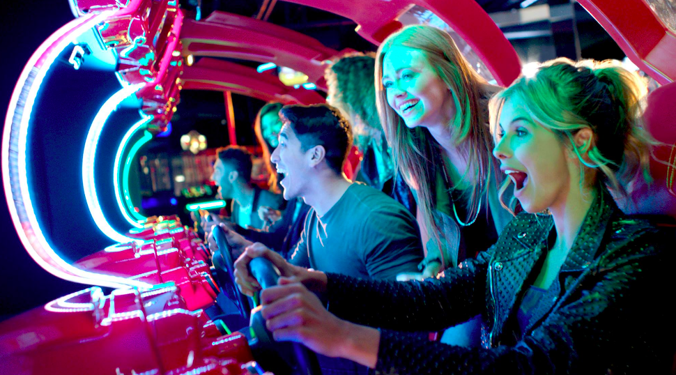 adults playing dave and busters games