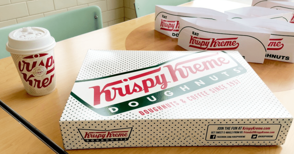 Krispy Kreme Doughnuts Dozen Box with coffee and hats