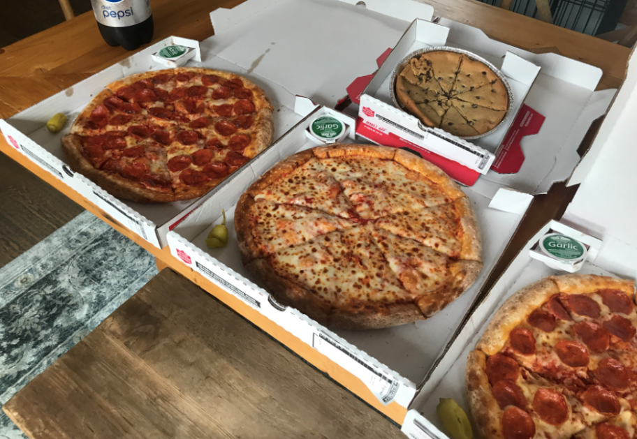 Papa john's pizzas on kitchen table