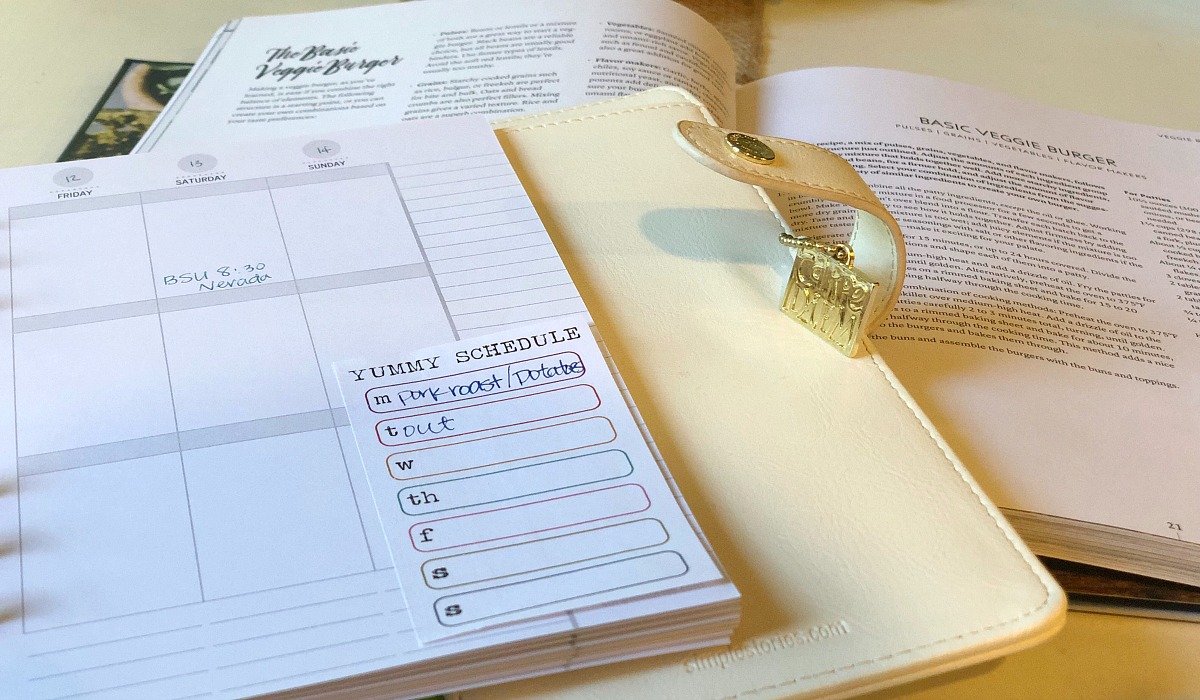 vegetarian meal planning tips for a meat-loving family – planner with recipe books planning meals