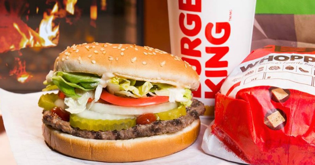 hamburger with soda in front of grill