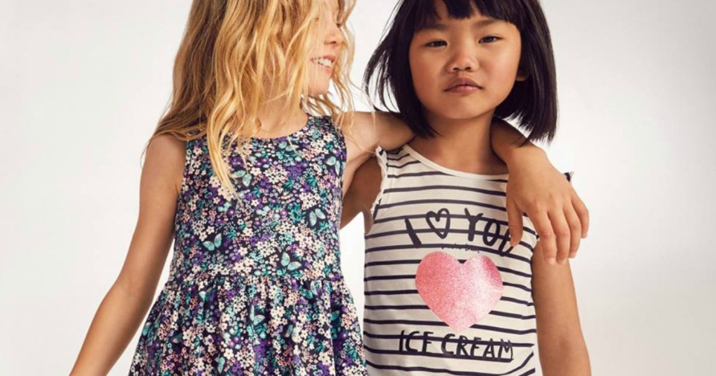 Two little girls in sun dresses 
