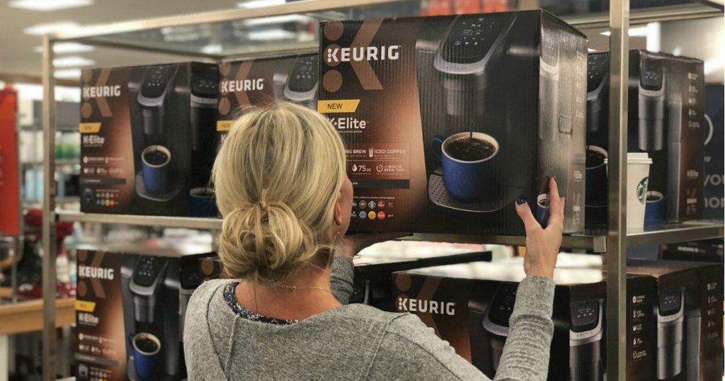 woman holding box of keurig coffee maker