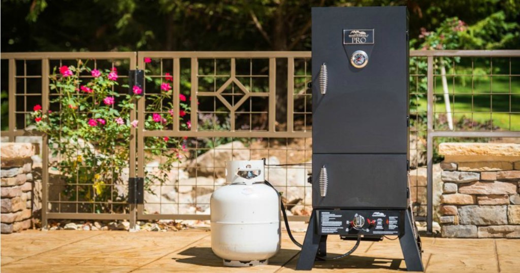 Masterbuilt Pro Smoker outside on a patio sitting next to a propane tank