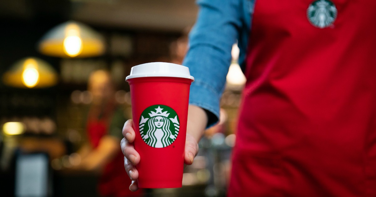 Barista with red Starbucks cup