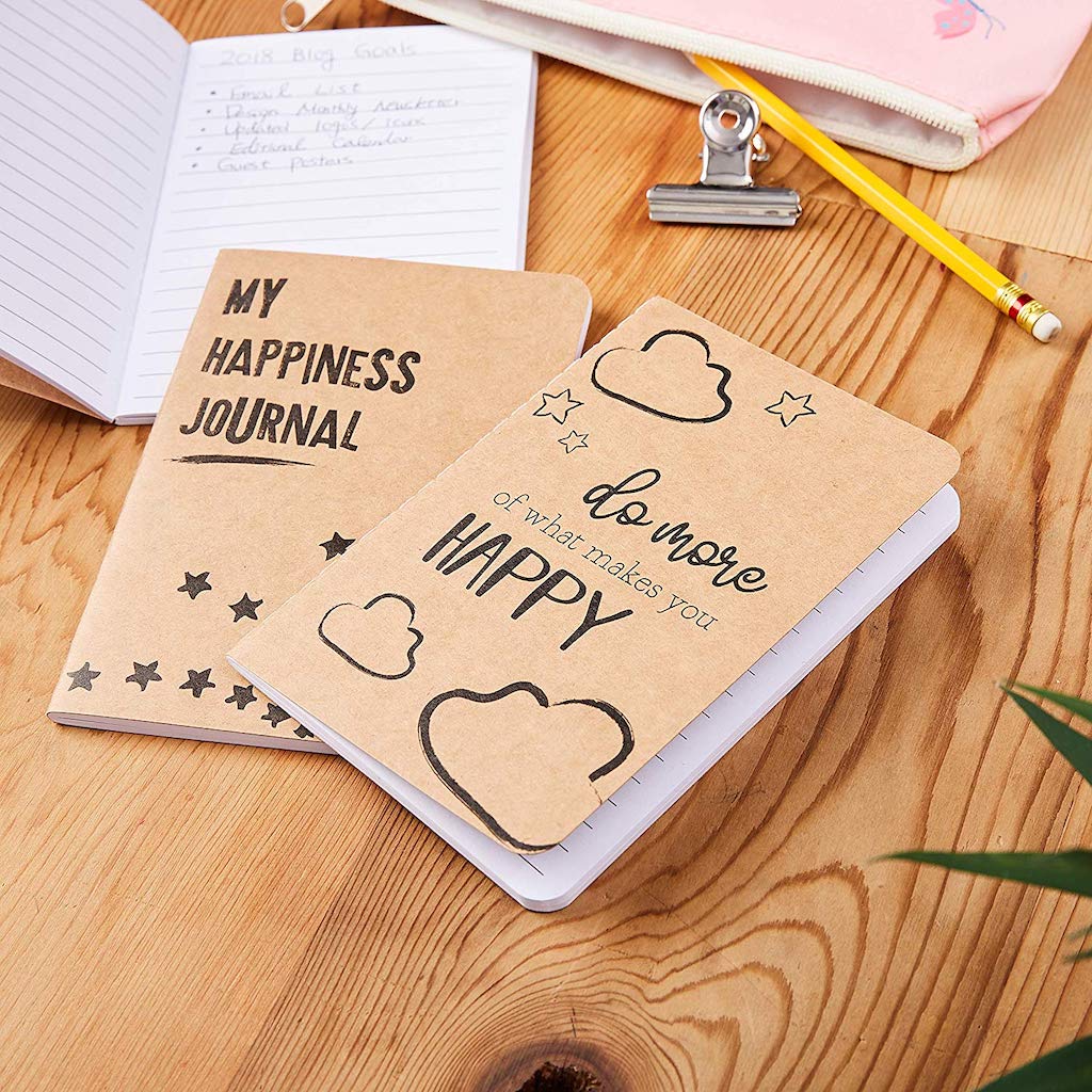happiness journals on desk