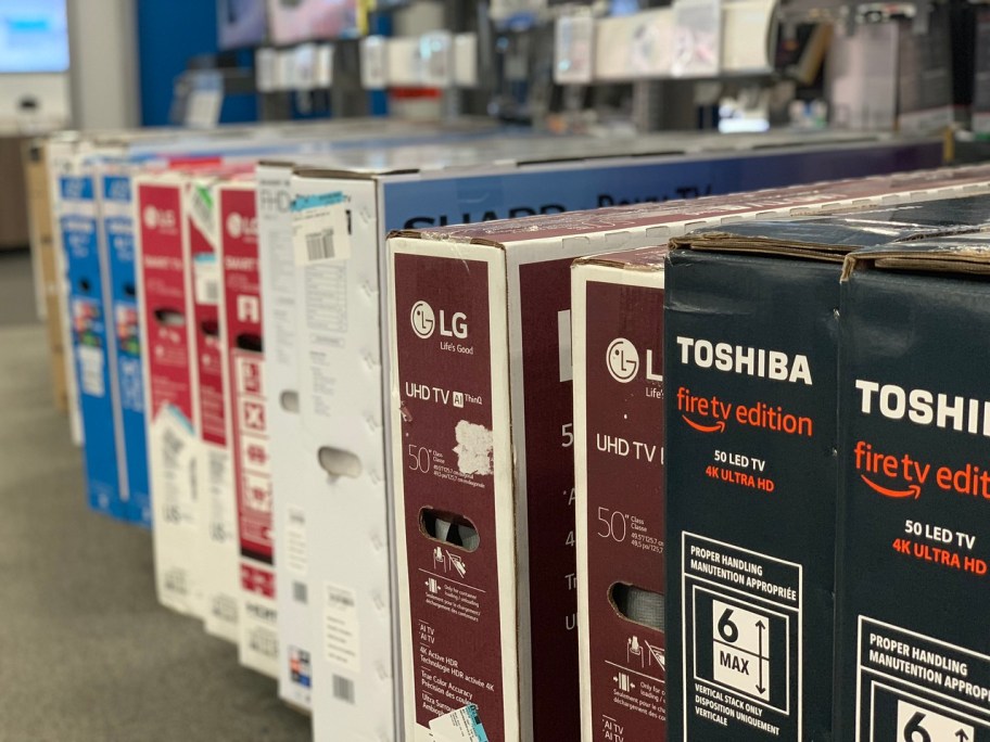 boxed TVs on display at Best Buy