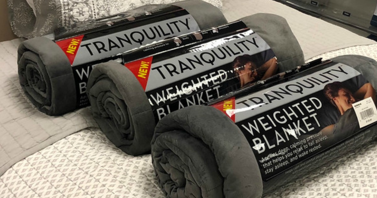 Tranquility Weighted Blanket on a bed from Walmart