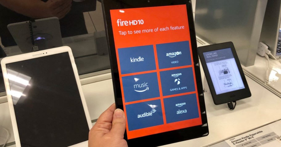 hand holding amazon fire hd 10 on display in store