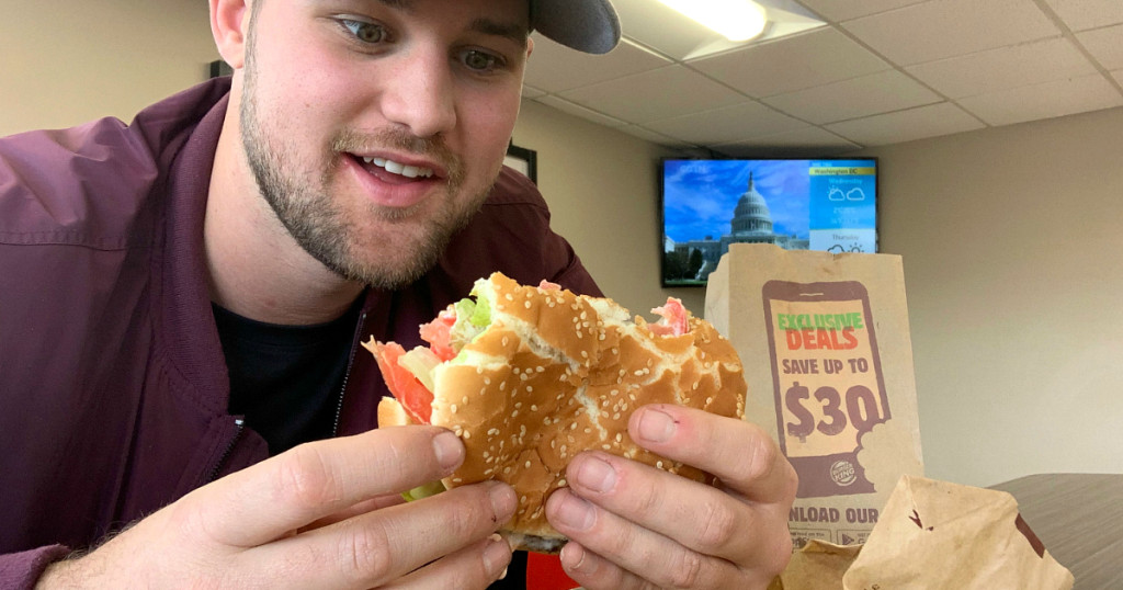 Stetson looking at a burger