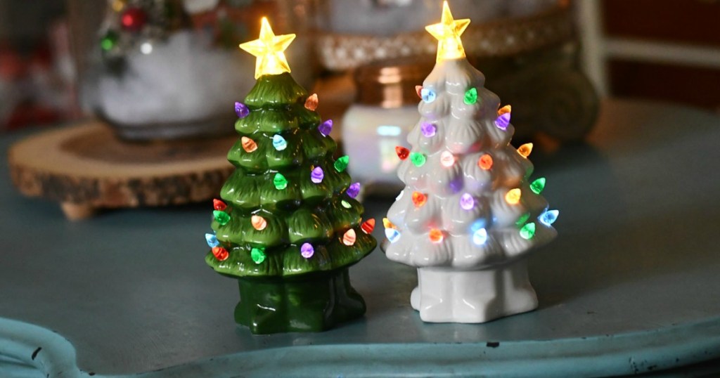 two lit up ceramic Christmas trees 