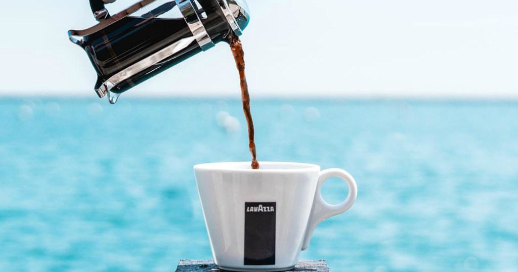 Lavazza Coffee being poured from a French press into a mug