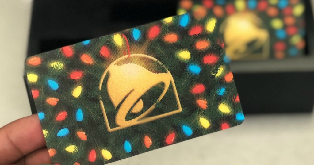 hand holding a Taco Bell Gift Card