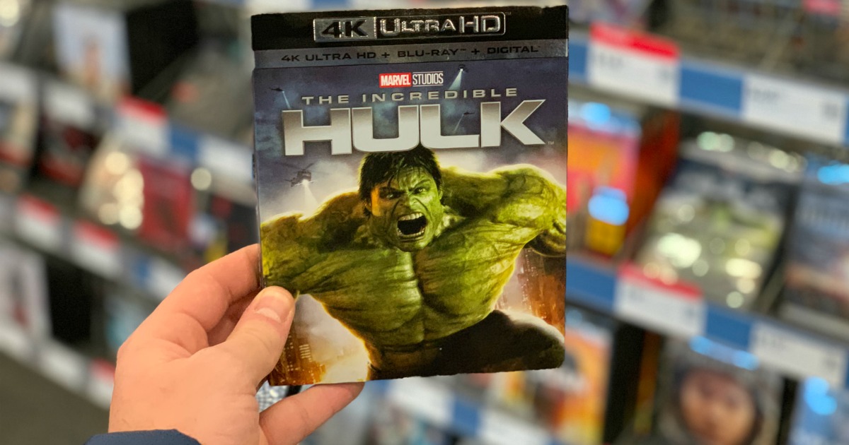 man holding The Incredible Hulk movie