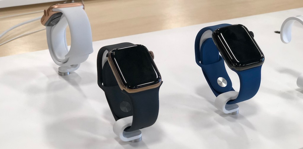 black blue white apple watches on display in apple store