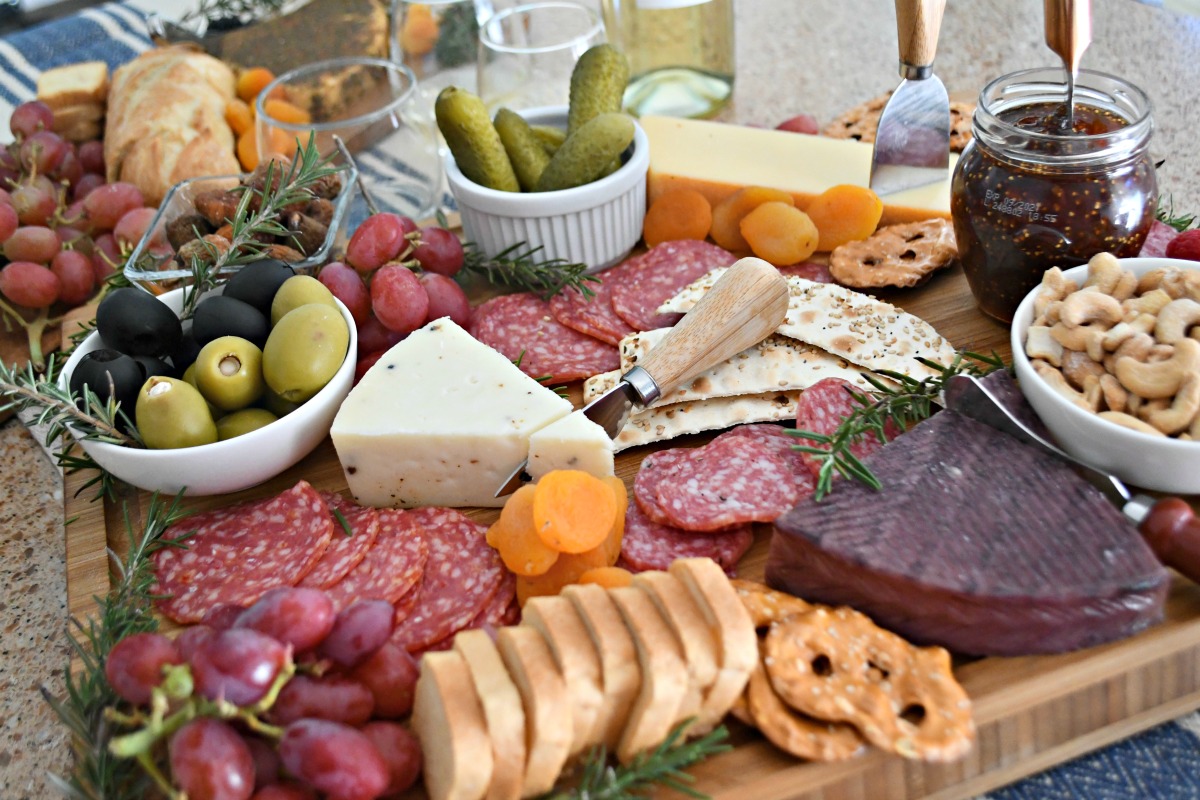 nuts, dried fruit, jam, cheese, olives closeup of the charcuterie board tray