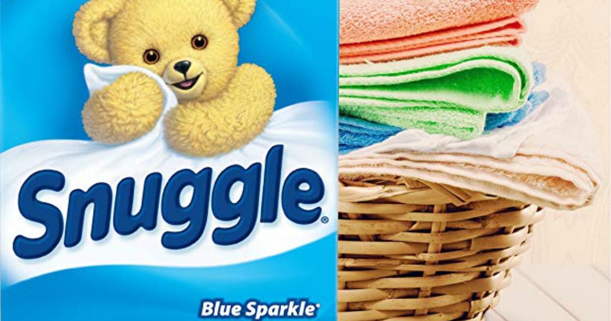 Snuggle dryer sheets next to a basket of towels