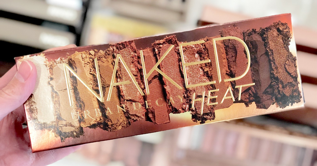 hand holding urban decay naked heat