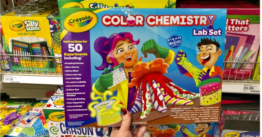 Hand holding Crayola Color Chemistry kit in store