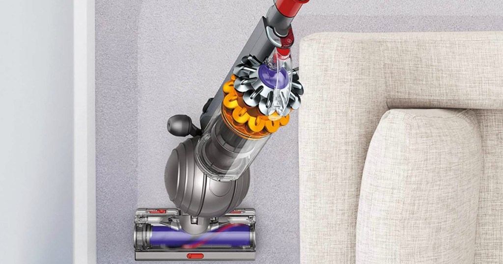 Dyson Vacuum by couch