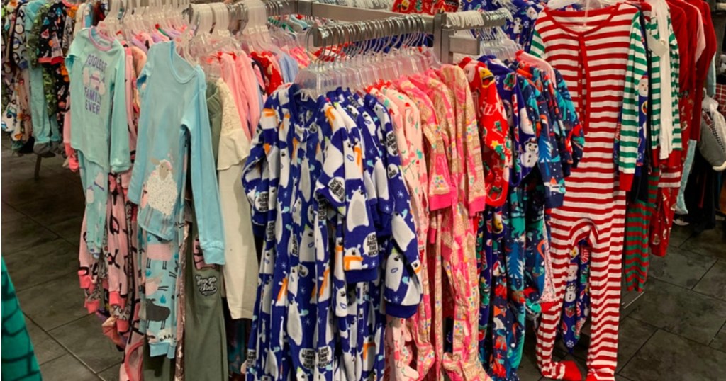 the children's place pajamas hanging on a store rack
