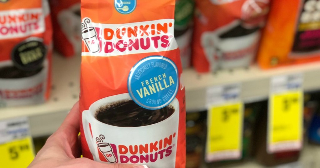 orange bag of coffee in front of shelf 