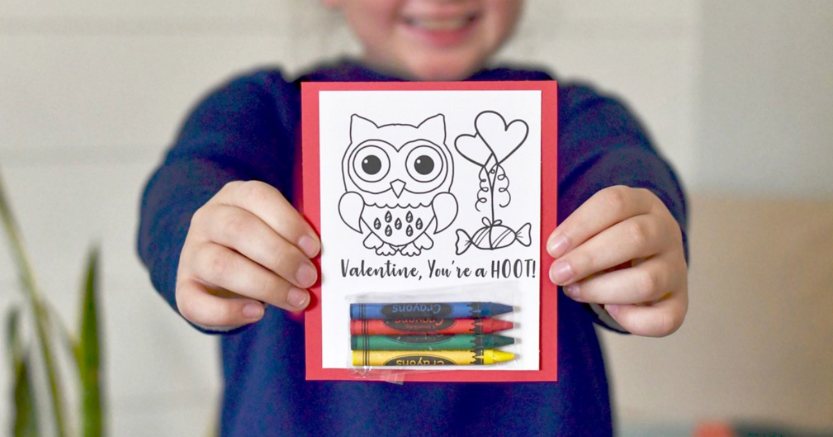 DIY Crayon Valentines (Free Printable Included) – young child holding an example