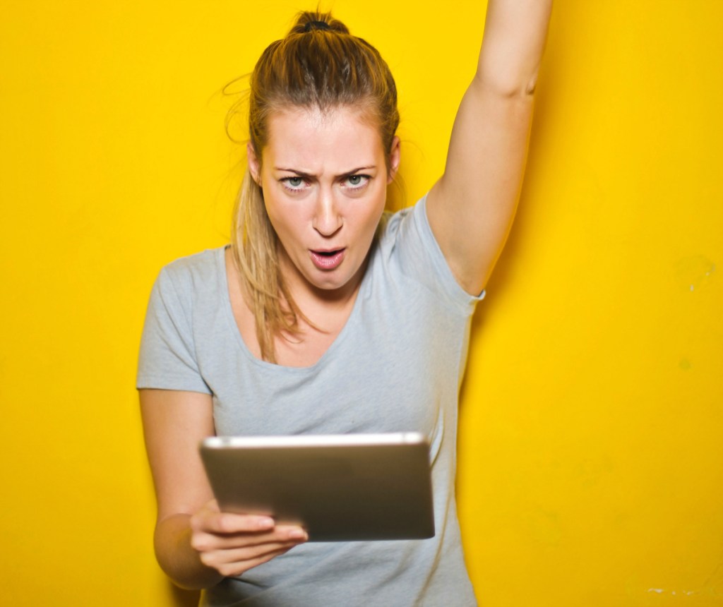 young woman happy with ipad