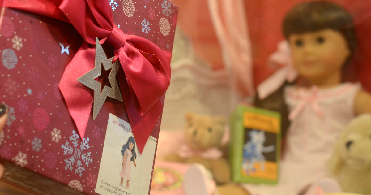 American Girl Doll near a wrapped gift box