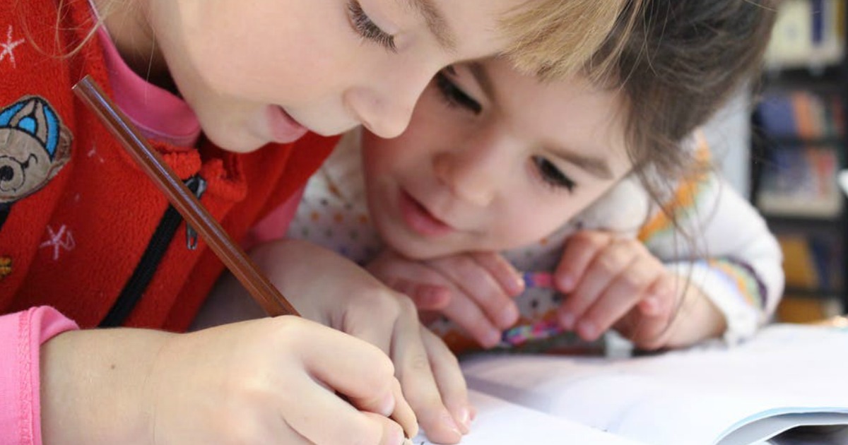 kids writing together