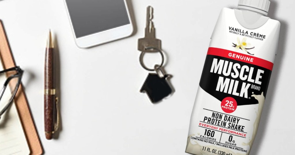 Muscle Milk VAnilla Creme protein shake with house key and phone