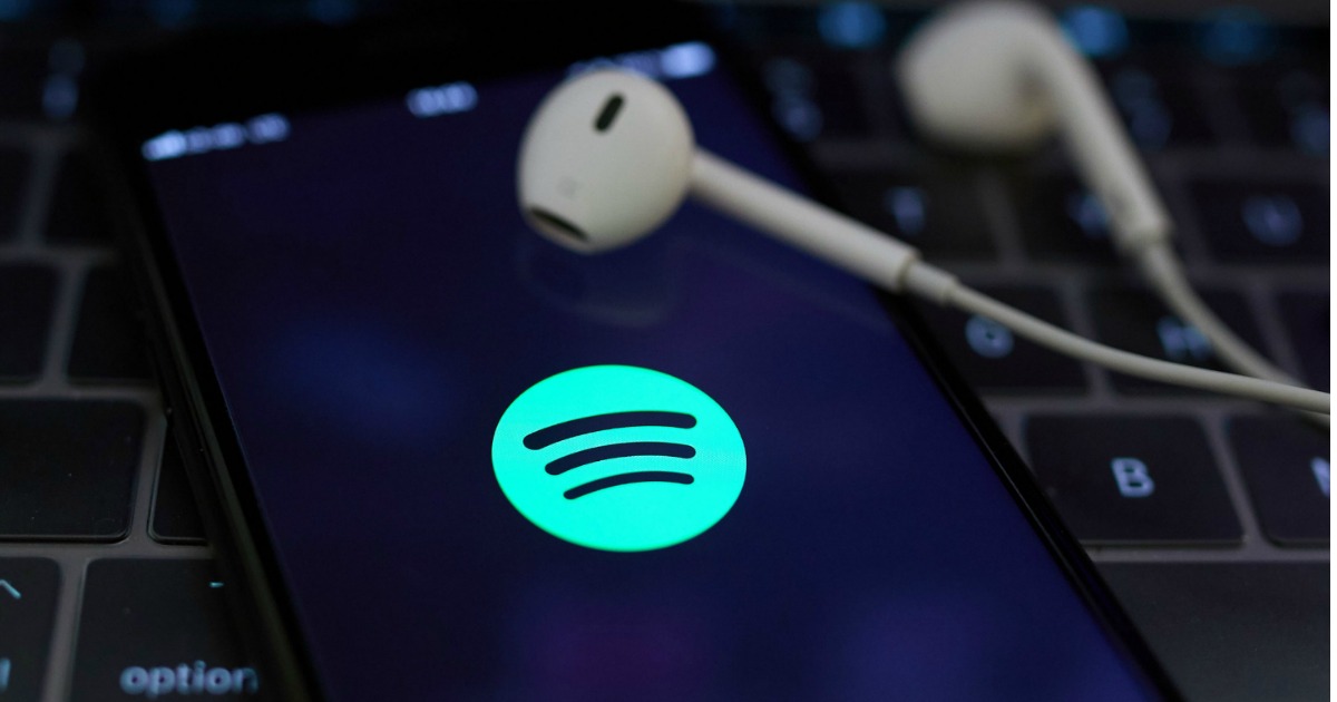 headphones on phone with spotify open