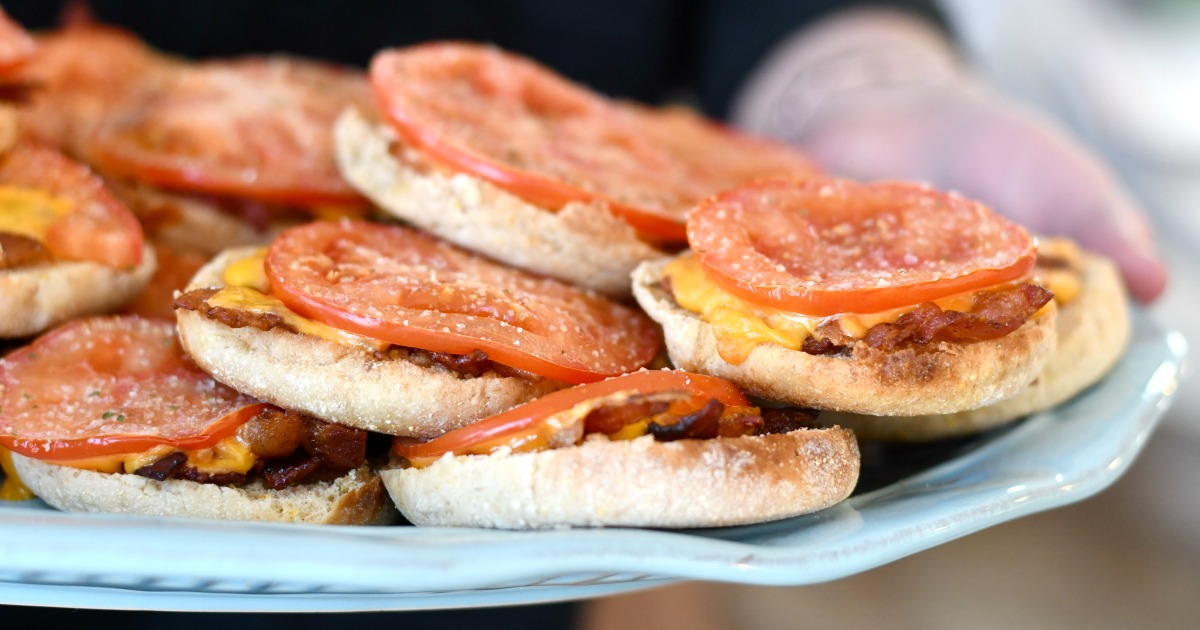 plate of bacon and tomato english muffins 