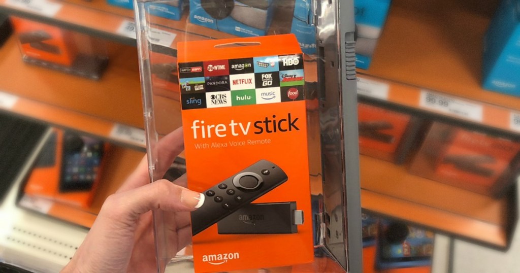 woman hand holding amazon fire stick