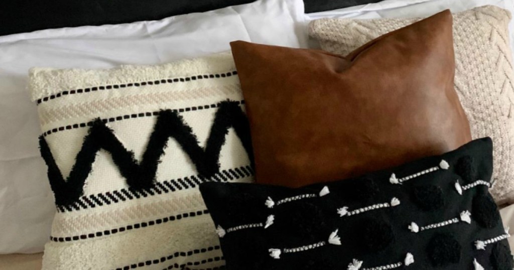 rustic throw pillows on bed 