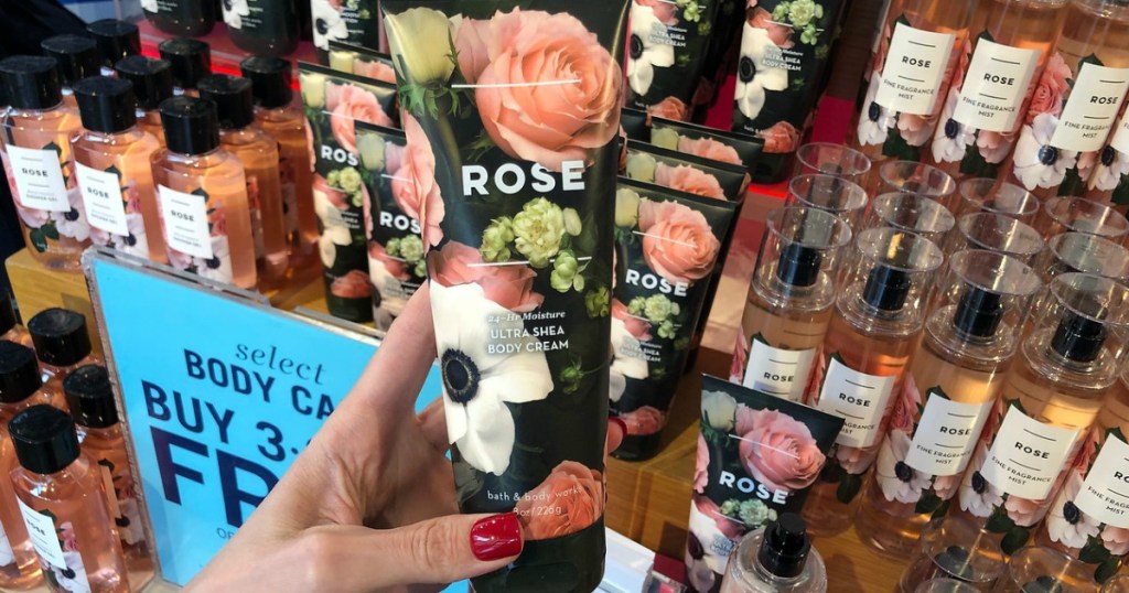 hand holding rose body cream