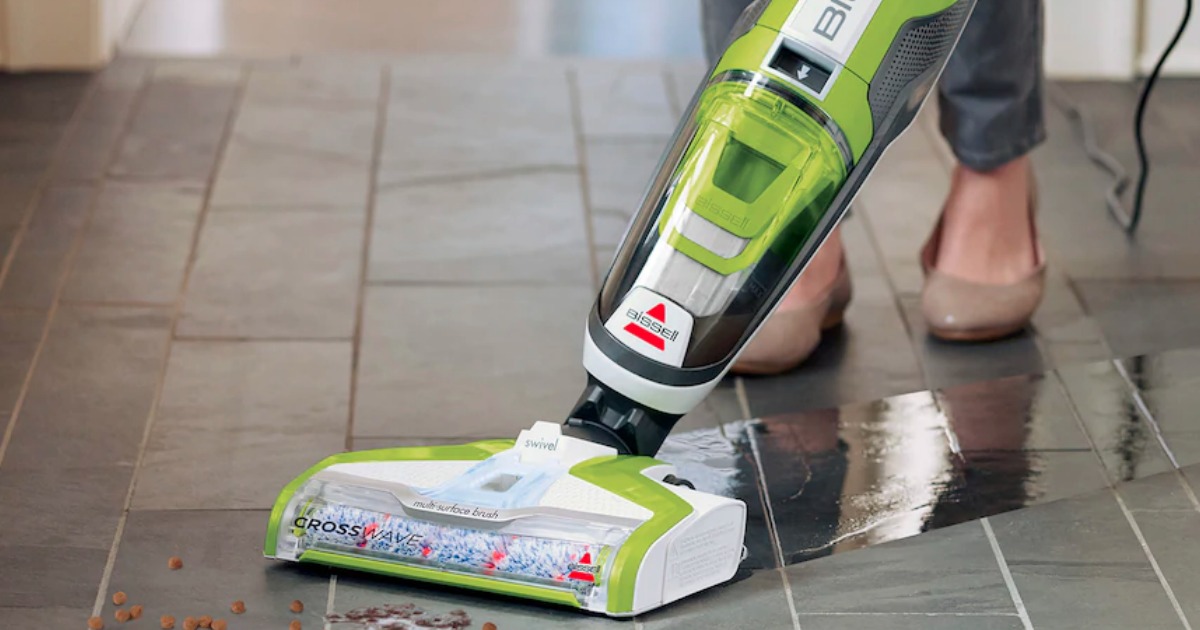 person using bissell vacuum mop on floor