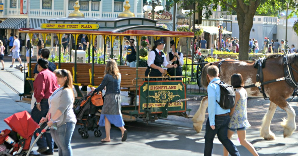 Disney park with people walking around
