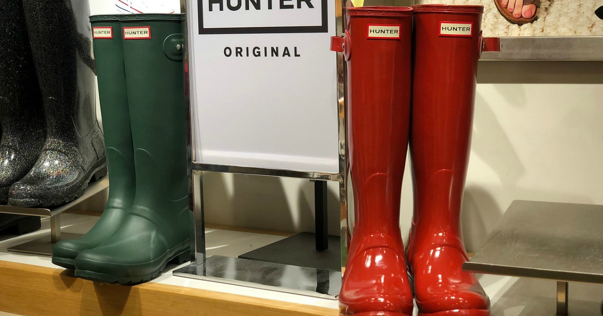 fall hunter boots on display with sign in green and red