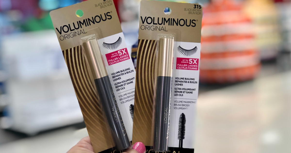 L’Oreal Voluminous Mascaras in hand at store