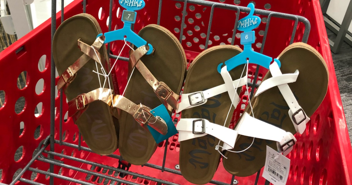 pairs of mad love sandals in a shopping cart in a store 