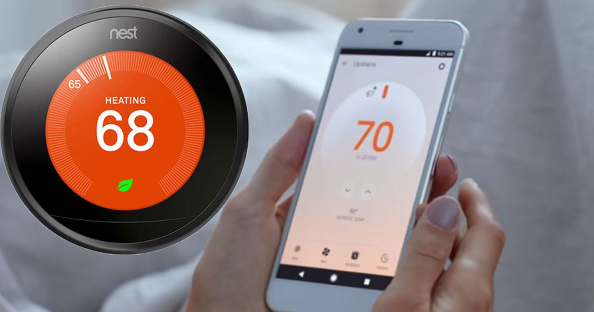 Nest Thermostat Black and smart phone being held that shows the Nest app