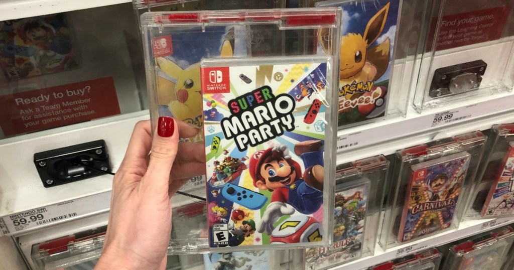 hand holding nintendo switch super mario party video game