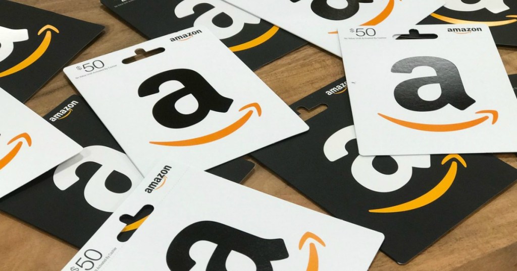 various amazon gift cards on table