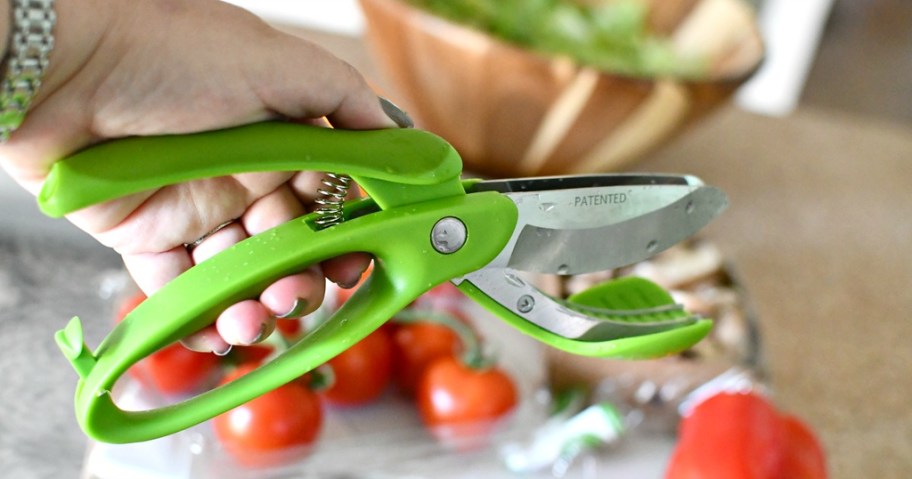 holding green salad tongs