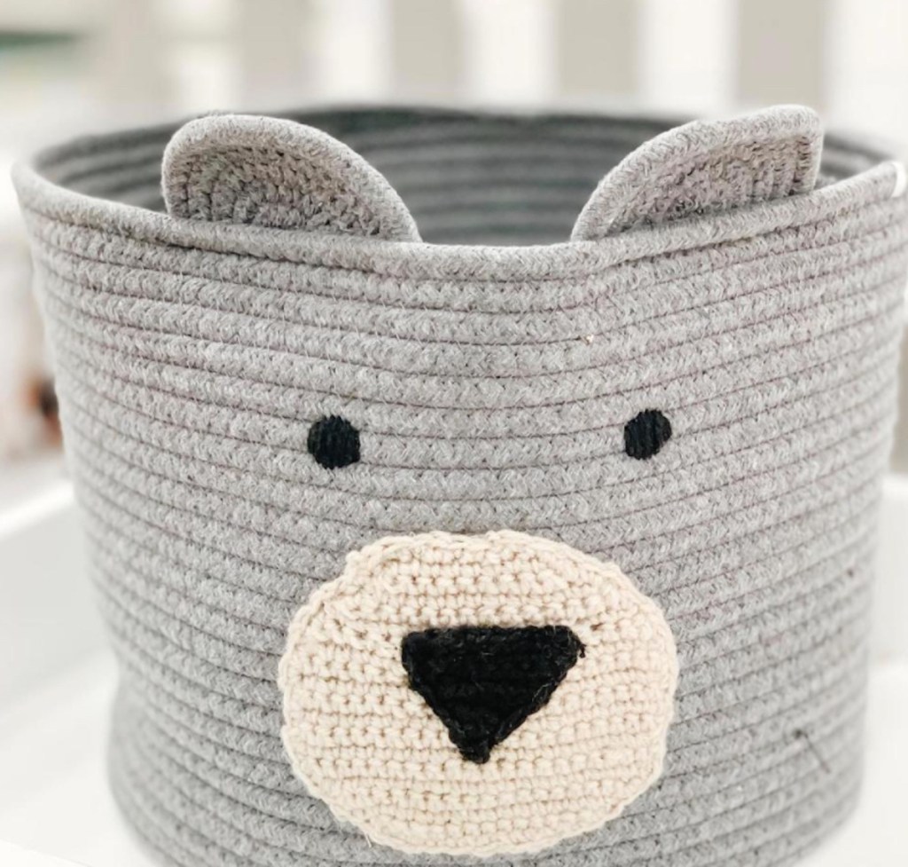 gray rope basket with bear face