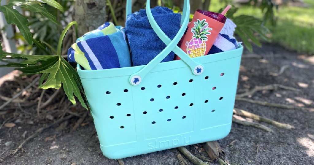 close up of blue waterproof bag with beach towels inside